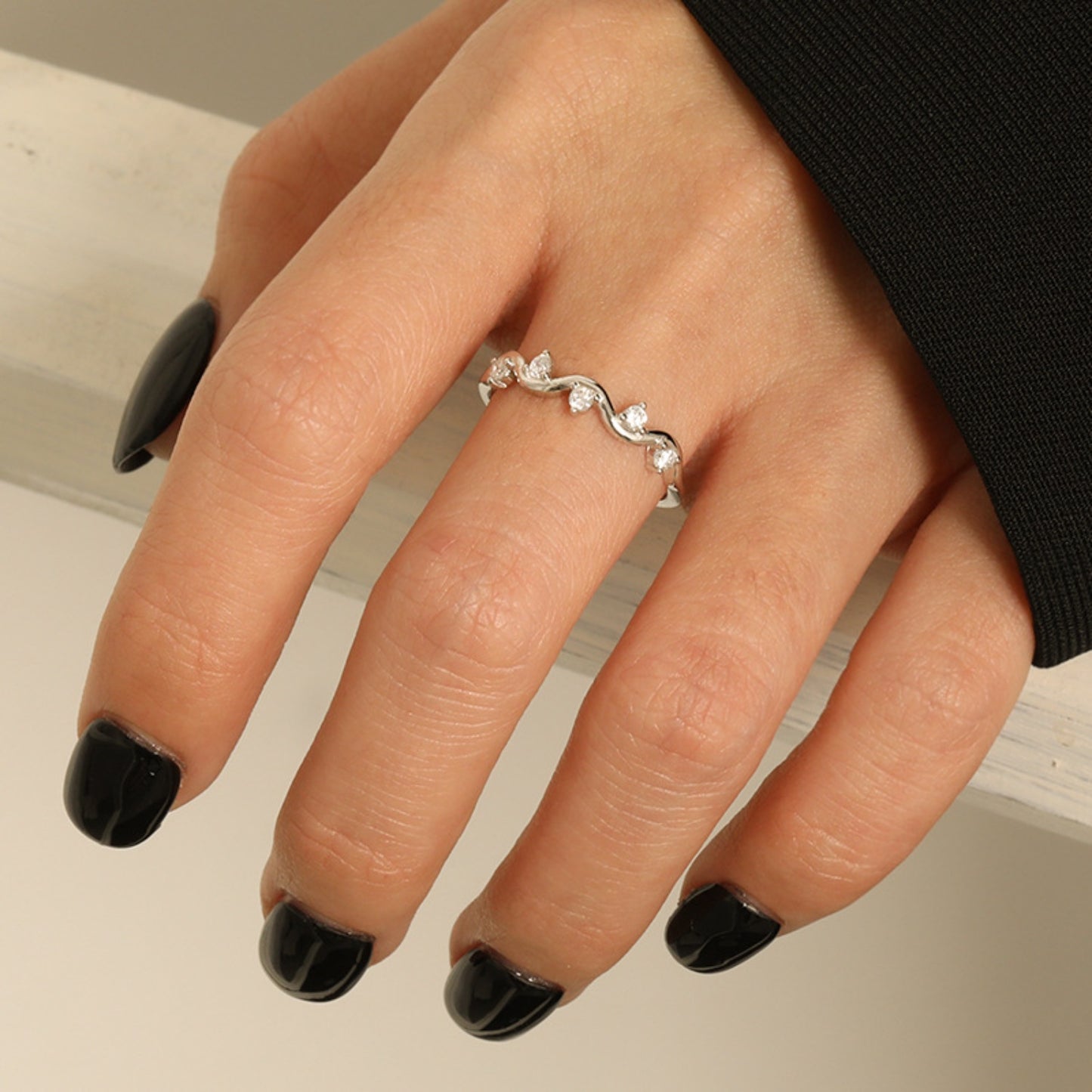 a woman's hand with a ring on it