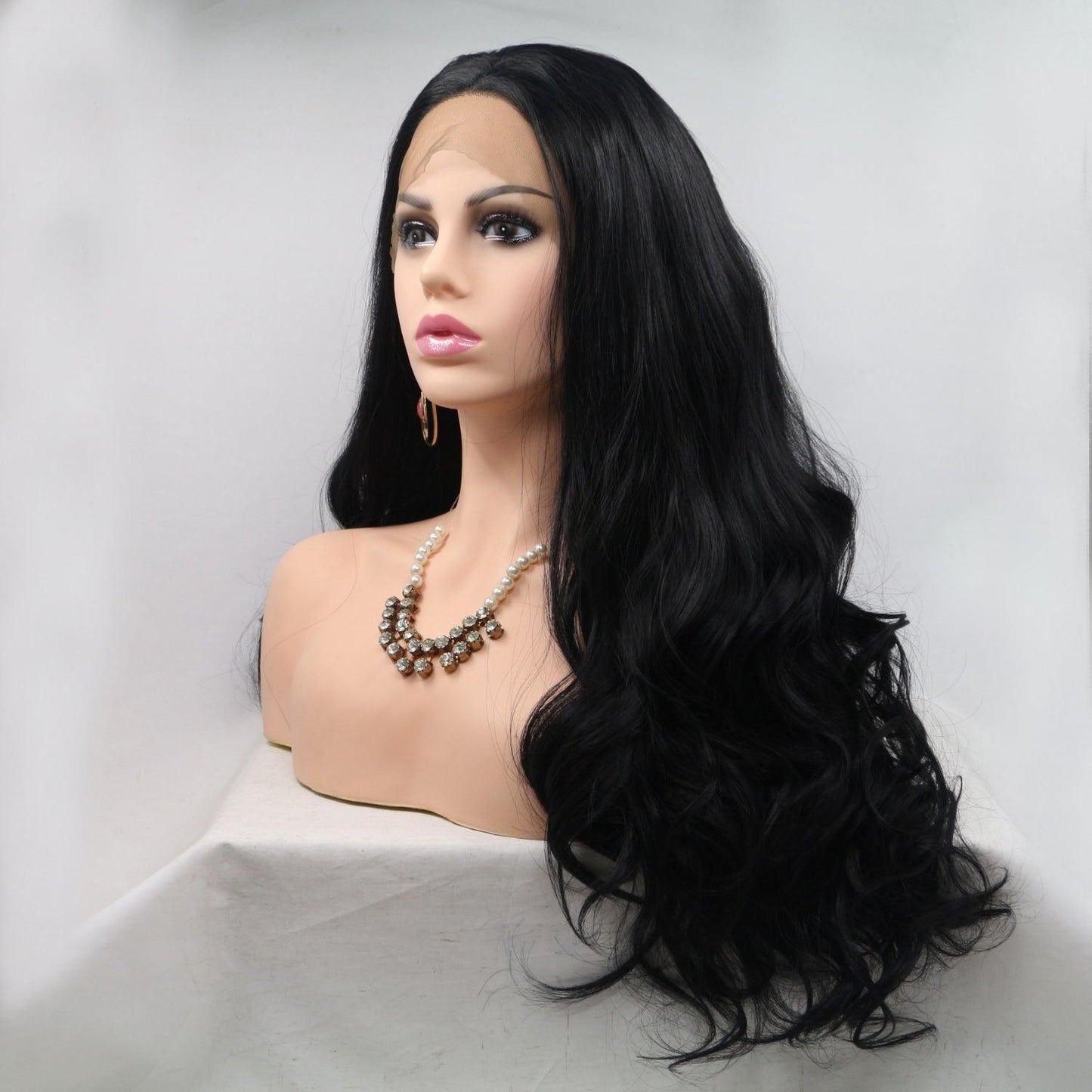 Stunning long wavy black wig with lovely accessories on female model