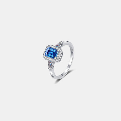 Stunning 1 carat moissanite ring in 925 sterling silver with a beautiful blue gemstone center and sparkling accents