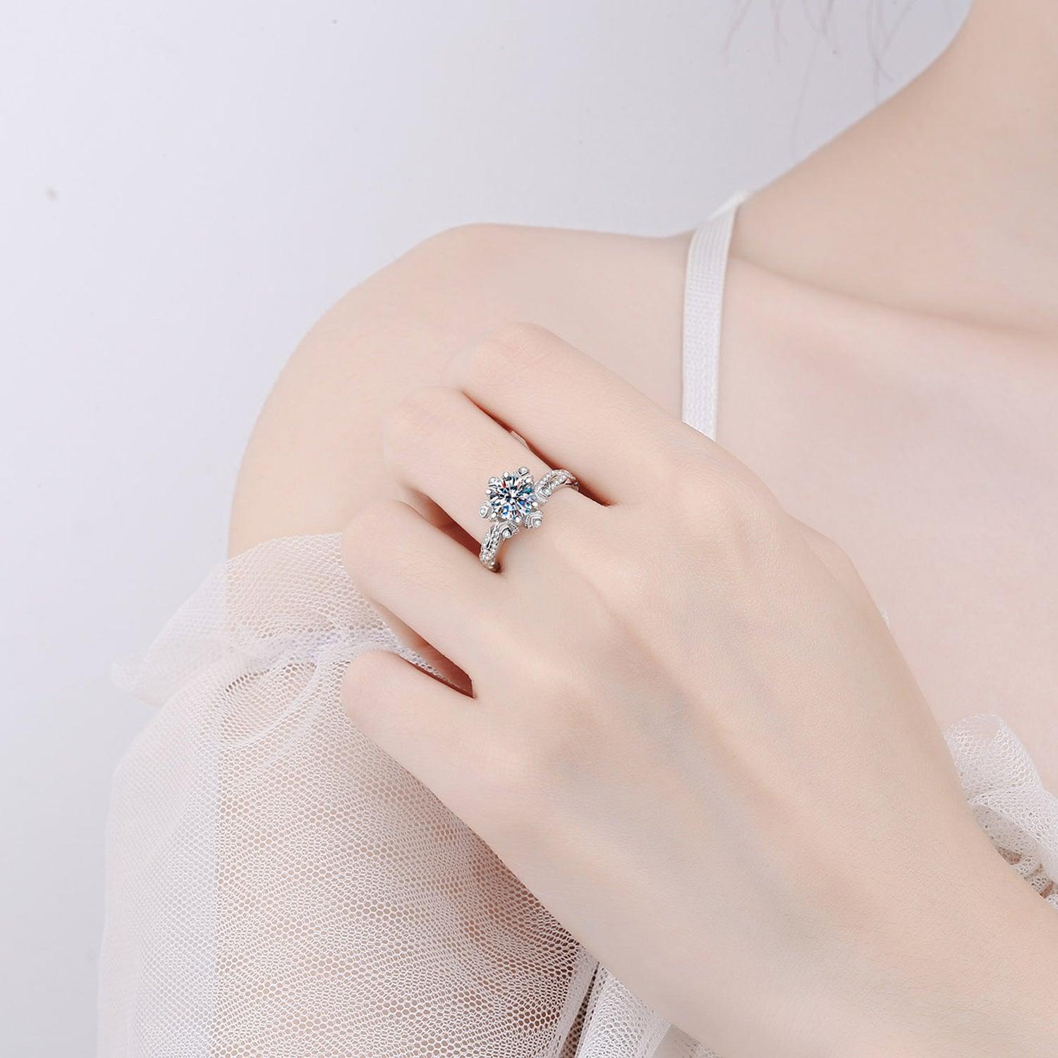 Elegant 1-Carat Moissanite Ring in 925 Sterling Silver, Resting on a Woman's Hand