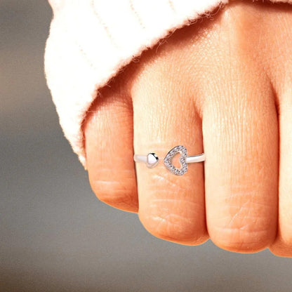 a woman's hand with a diamond ring on it