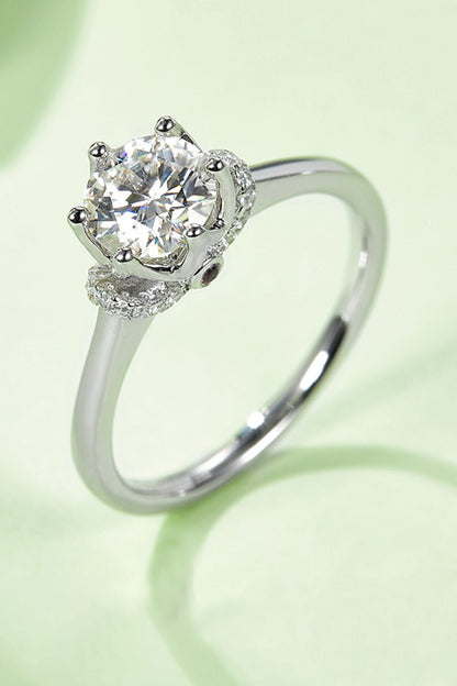 Stunning 1 Carat Moissanite Solitaire Ring on Green Background