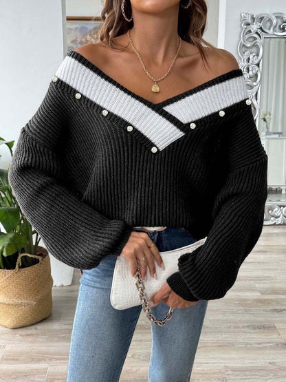 a woman wearing a black and white sweater