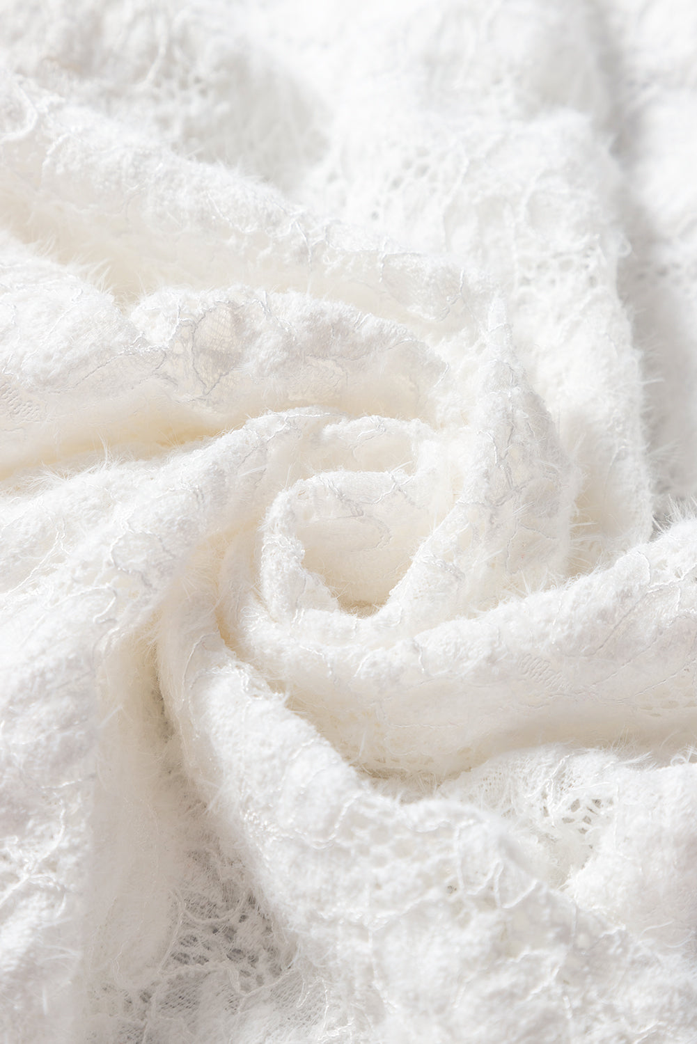 a close up of a white fabric with a white background