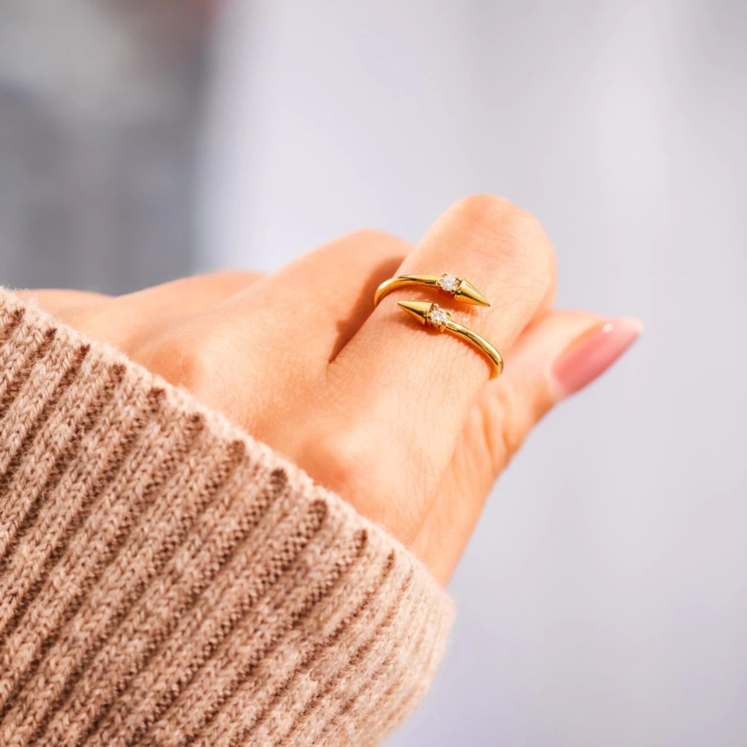 a woman's hand with a ring on it