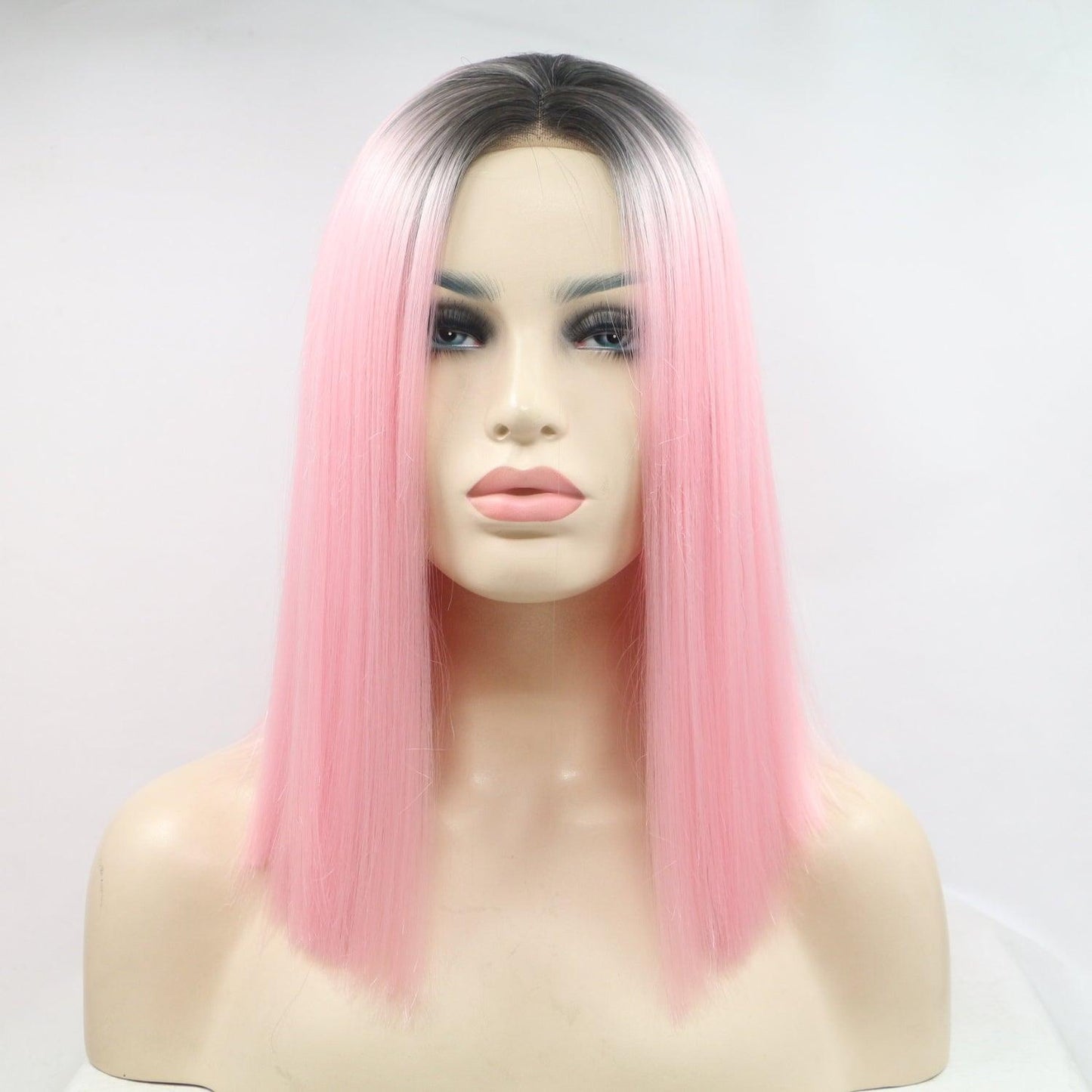 Vibrant pink wig with ombré effect, 13"x3" lace front, synthetic mid-length straight hair, 130% density for full, voluminous look.