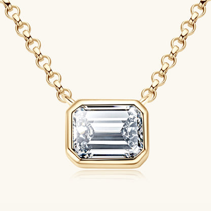 Elegant gold chain necklace with a large square-cut diamond pendant