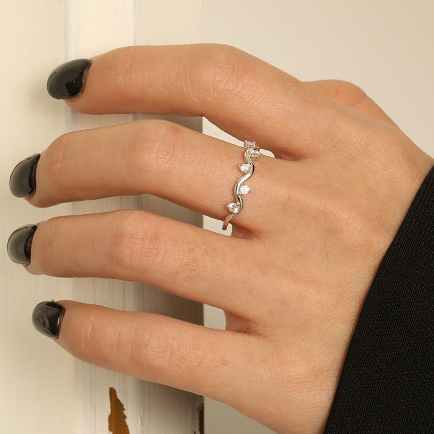 a woman's hand with a ring on it