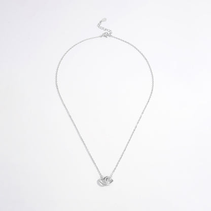 a silver necklace with a heart on it