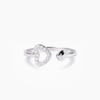 a white gold ring with a heart shaped diamond