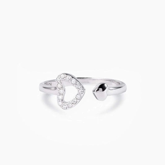 a white gold ring with a heart shaped diamond