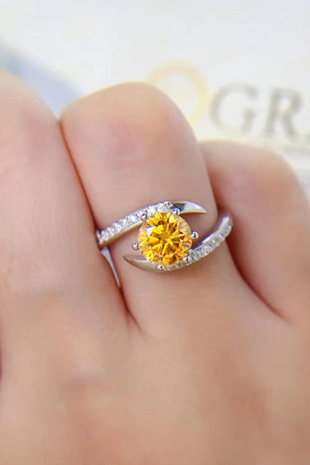 Elegant 1 Carat Moissanite Ring with Sparkling Yellow Center Stone and Shimmering Accents on Sterling Silver Band