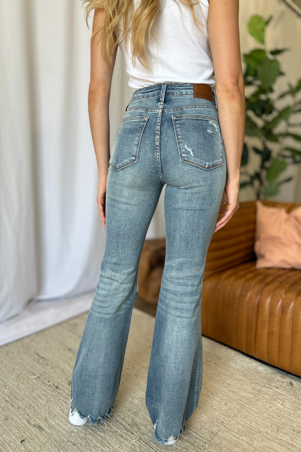 a woman in a white shirt and jeans