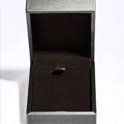 Elegant gray jewelry box with open compartment, showcasing a luxurious necklace presentation.