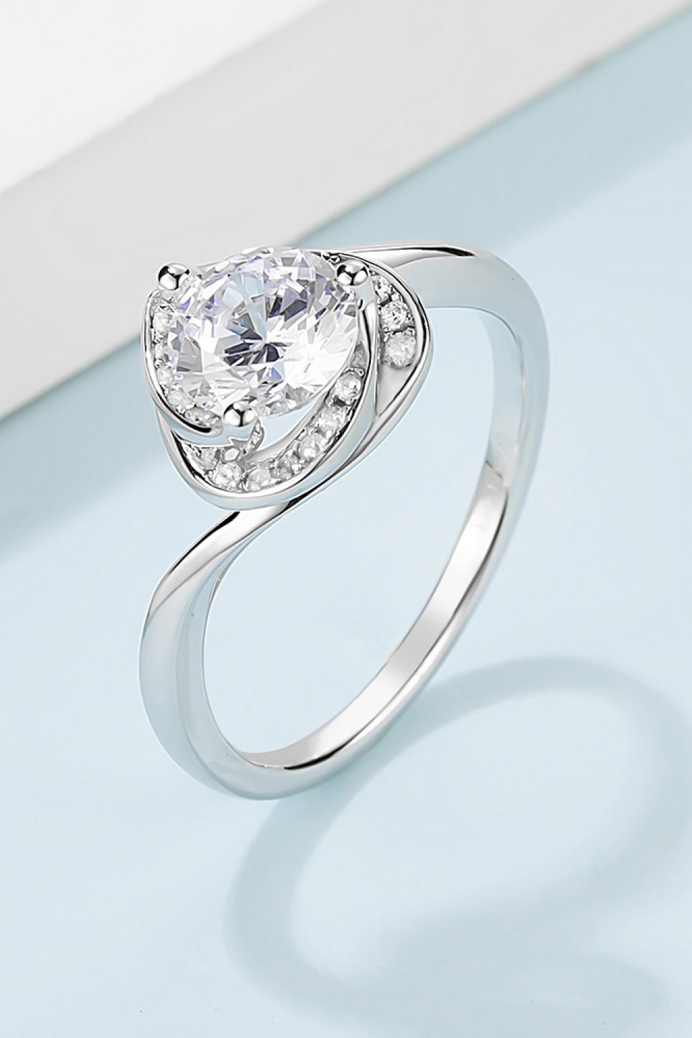 Elegant 1 carat moissanite engagement ring featuring a sterling silver heart-shaped design with sparkling accents.