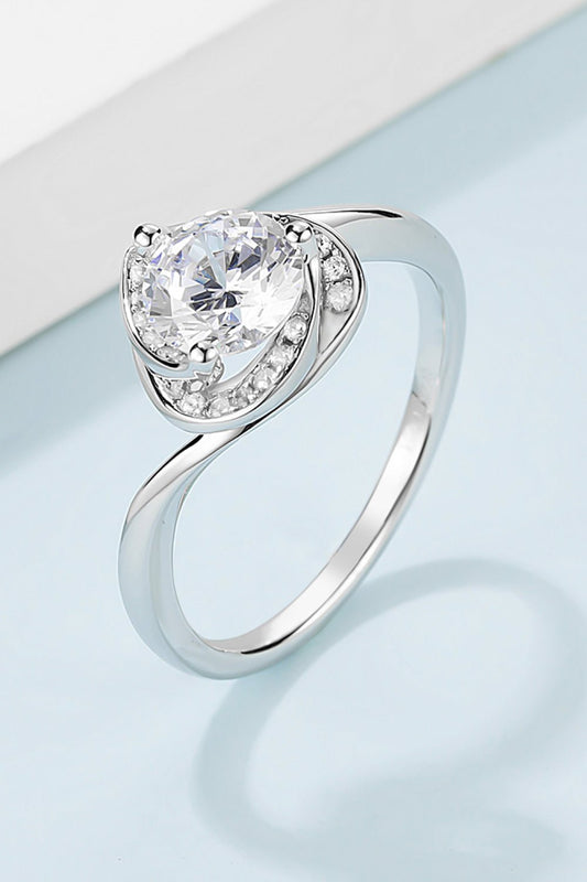 Elegant 1 carat moissanite engagement ring featuring a sterling silver heart-shaped design with sparkling accents.