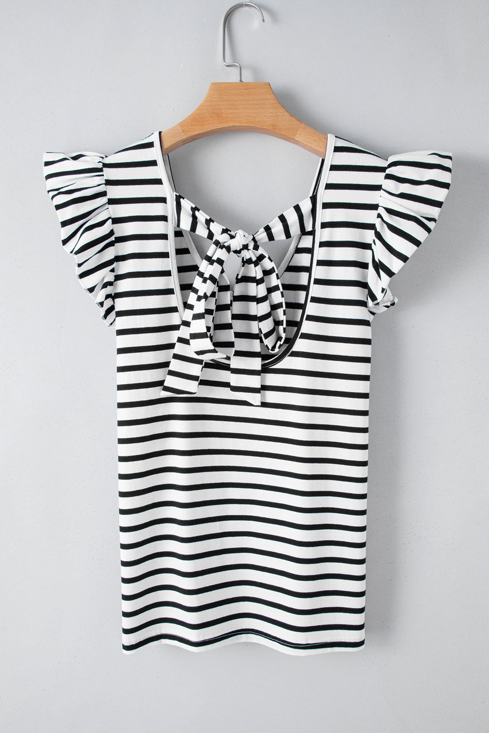 a black and white striped top with a bow