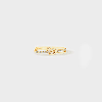 a gold ring with a diamond band