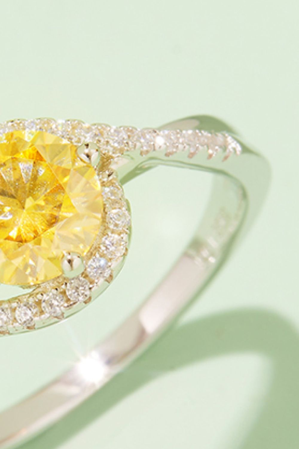 Elegant yellow moissanite engagement ring with sparkling diamond halo in 925 sterling silver