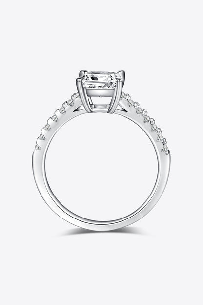 Elegant moissanite solitaire engagement ring with diamond accents on a sterling silver band