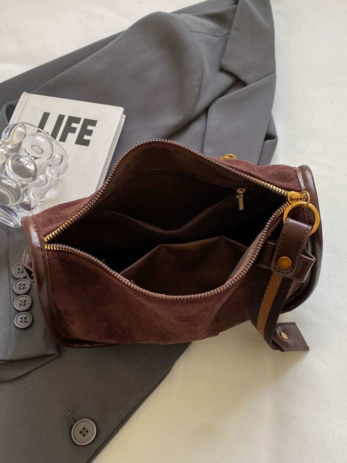 a brown purse sitting on top of a table