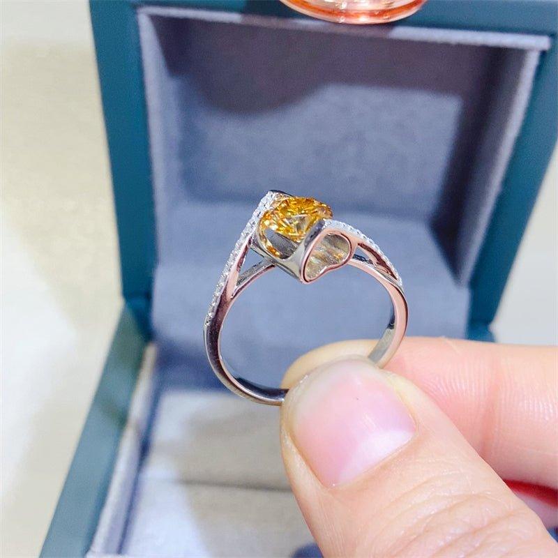 Stunning yellow gemstone ring showcased in a jewelry display box. The ring features a vibrant, dazzling center stone surrounded by a delicate silver band. This eye-catching piece of jewelry would make a stunning accessory for any occasion.