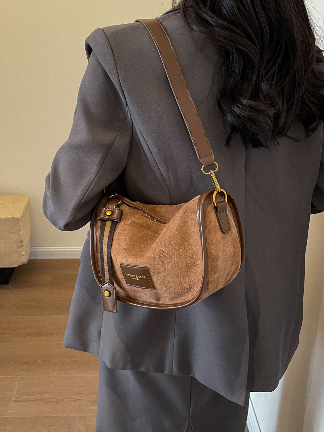 a woman with a brown purse on her back