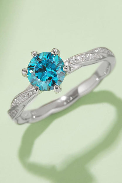 Dazzling Moissanite Engagement Ring: Stunning 1 carat blue moissanite center stone set in a silver band with sparkling accents