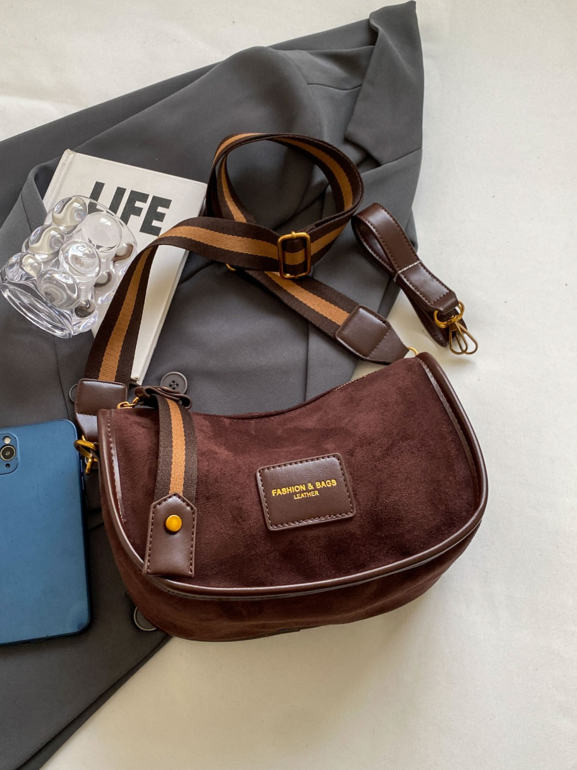 a brown purse sitting on top of a table