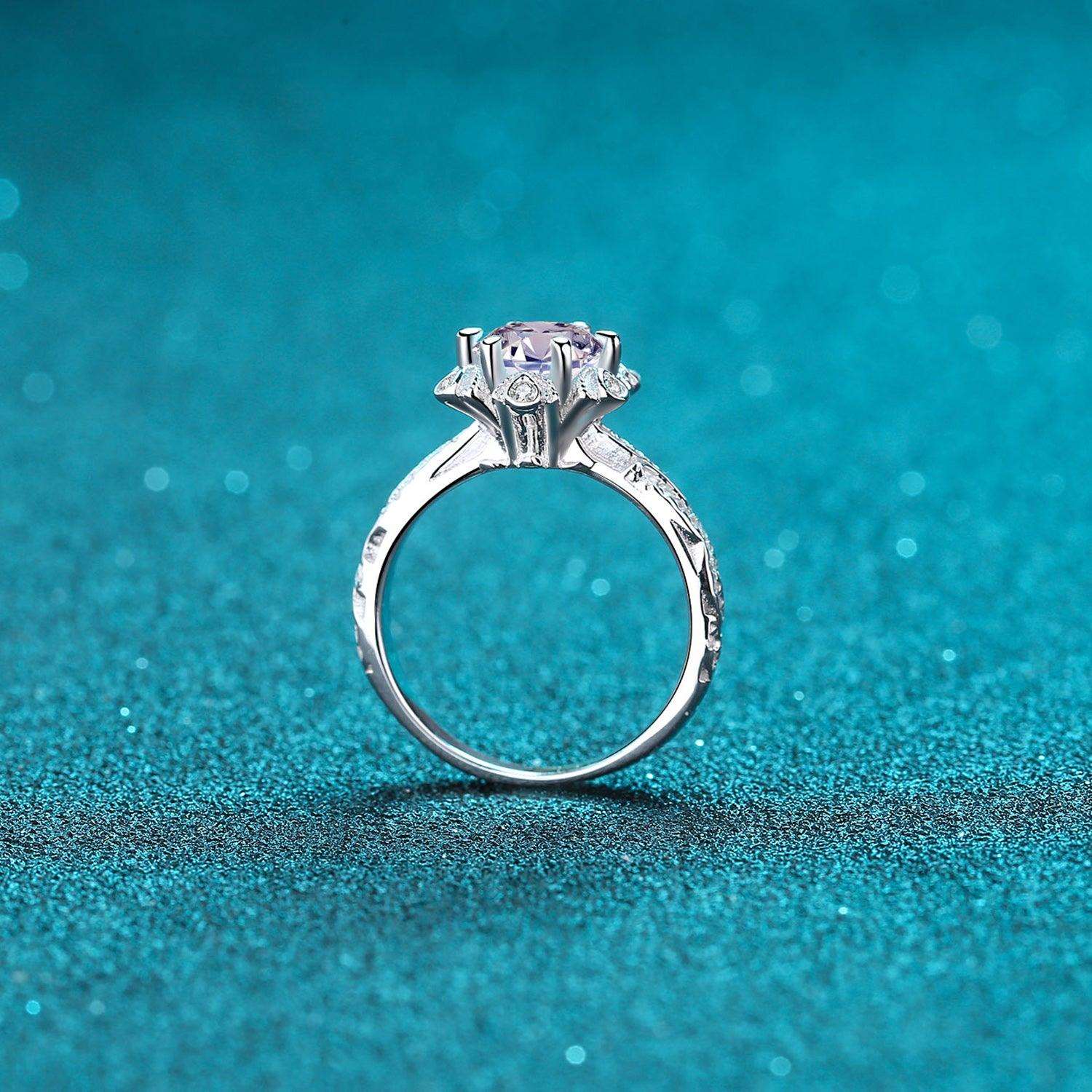 Elegant 1 Carat Moissanite Engagement Ring on Turquoise Backdrop