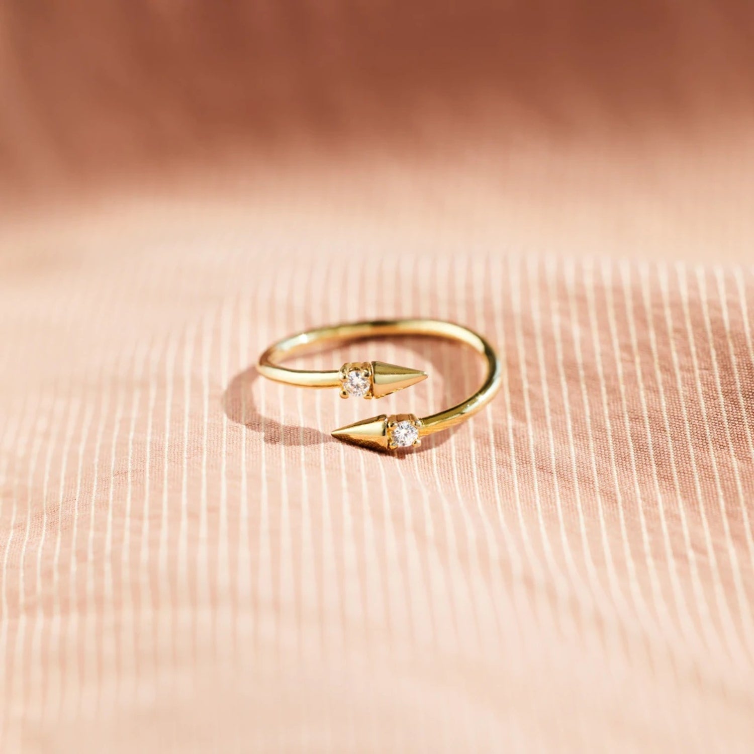 a close up of a gold ring with diamonds