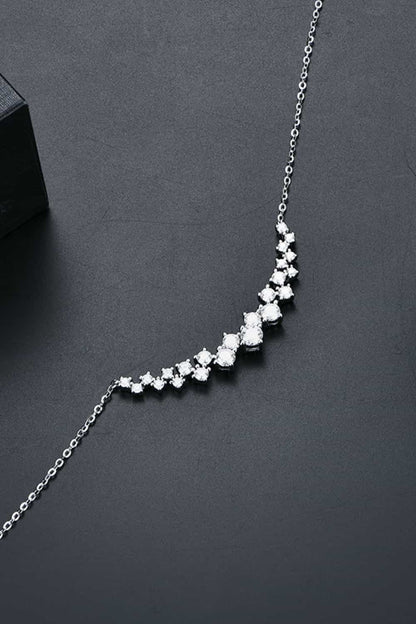 Elegant Moissanite Sterling Silver Necklace - Sparkling array of stones creating a stylish curved design on a silver chain.