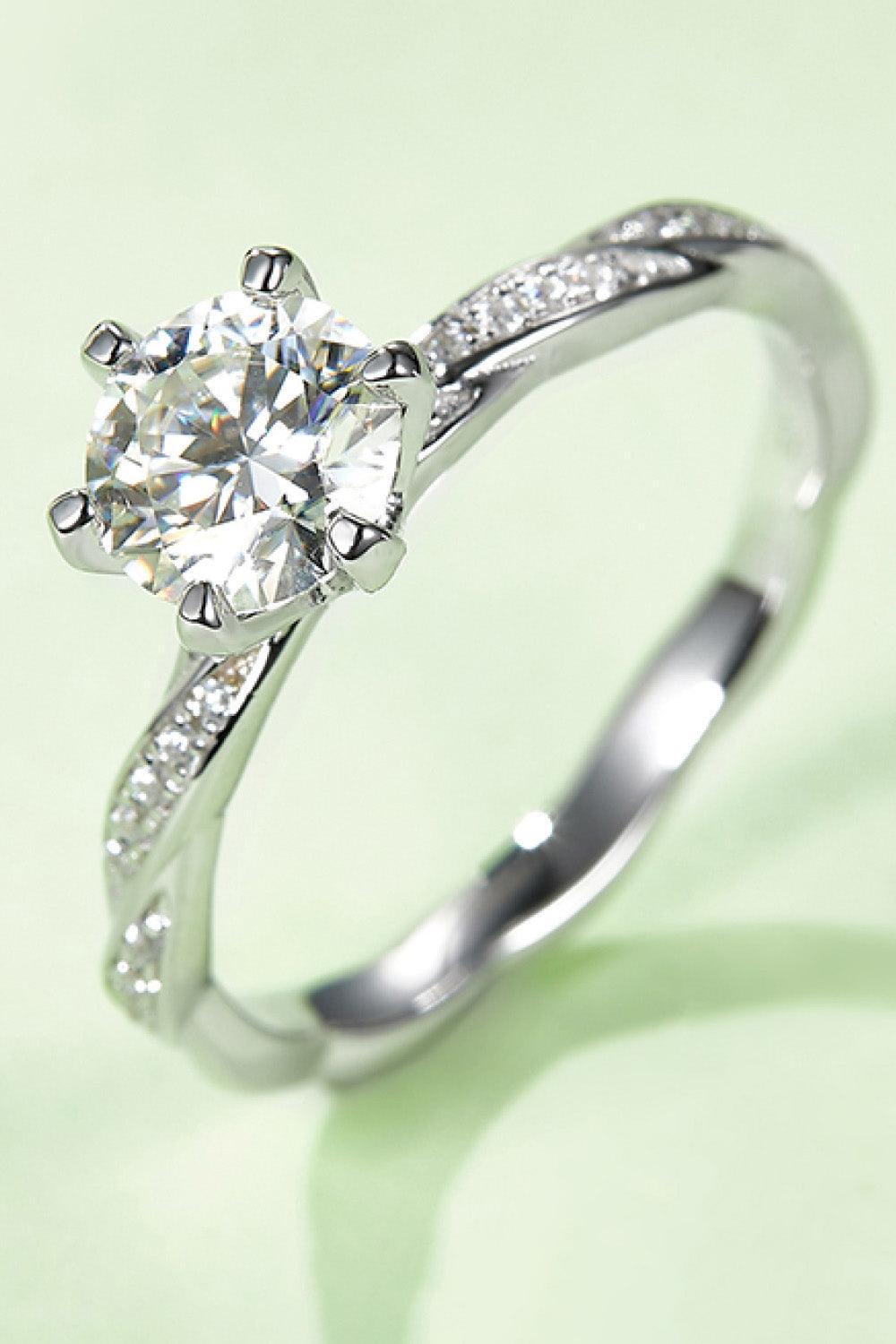 Elegant 1 carat moissanite solitaire ring in sterling silver with pave-set diamonds on the band