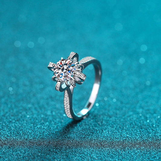 Elegant 1 Carat Moissanite 925 Sterling Silver Floral Ring on Glittering Teal Background