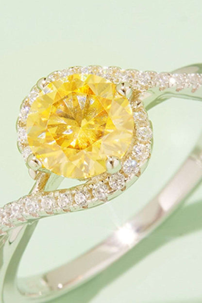 Brilliant yellow moissanite gemstone in sterling silver halo setting