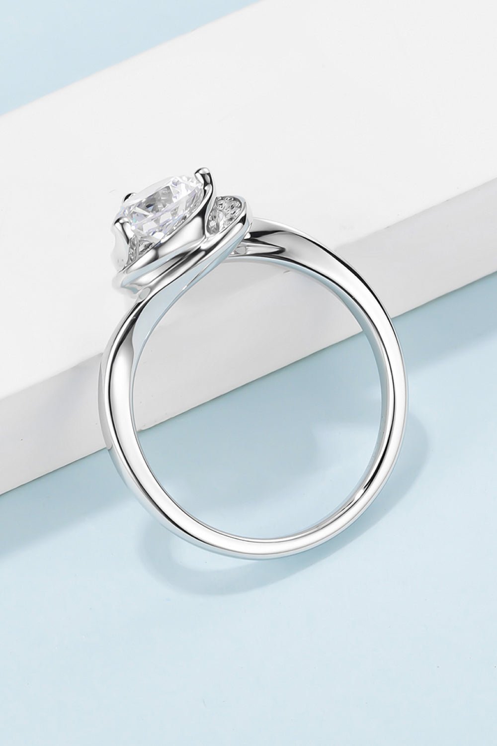 Elegant sterling silver ring with a sparkling moissanite center stone in a heart-shaped design