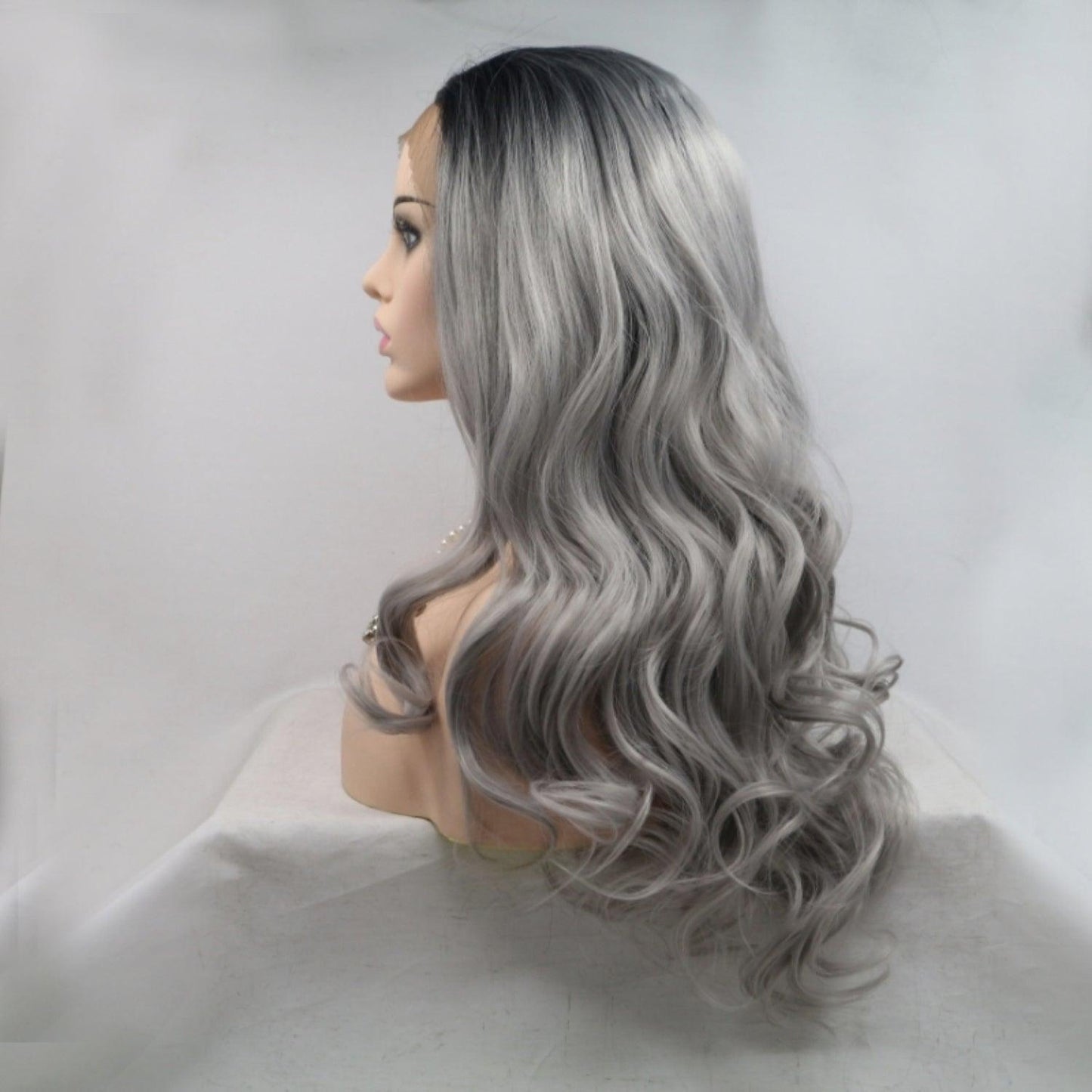 Wavy silver-gray wig with long flowing curls on model