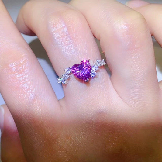 Elegant purple heart-shaped moissanite gemstone ring on female hand